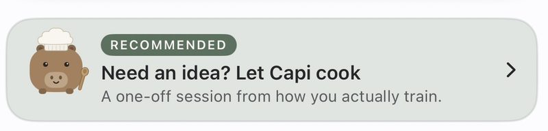 A card from the app: Capi the capybara wearing a chef’s hat and holding a spoon, beside the words Need an idea? Let Capi cook — a one-off session from how you actually train.